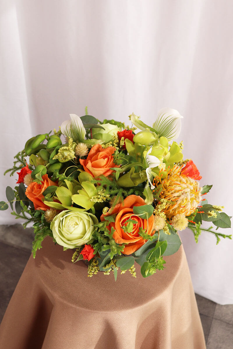 季節のおまかせオレンジ・グリーン系コンパクトアレンジ